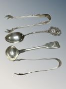 Two pairs of silver sugar tongs and two spoons CONDITION REPORT: 66g gross