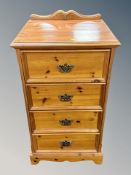 A contemporary pine four drawer chest together with matching pair of bedside chests