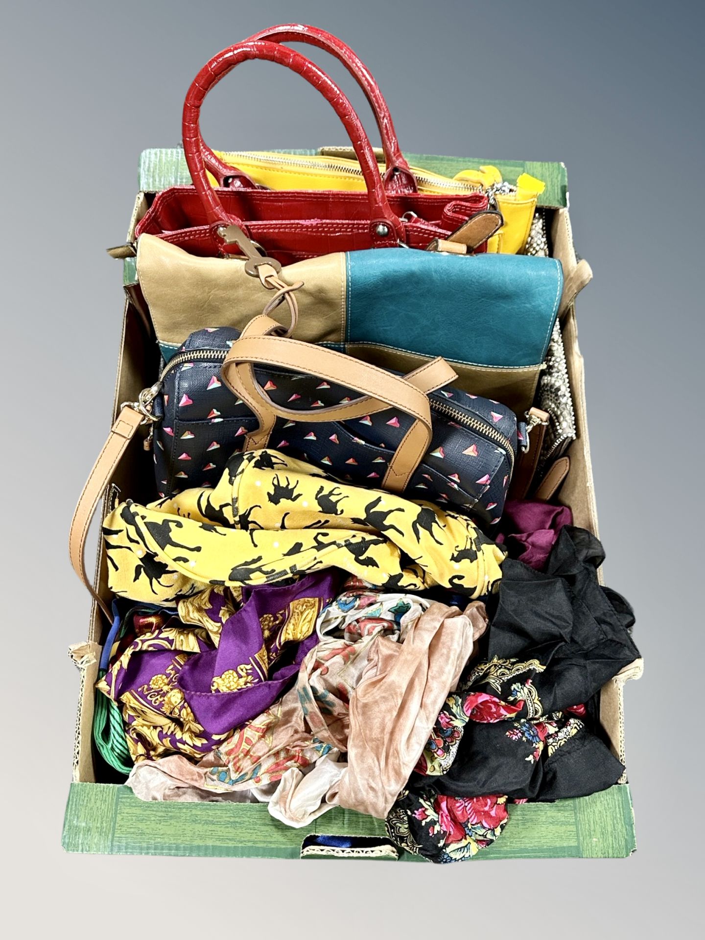 A collection of silk scarves and group of lady's leather hand bags