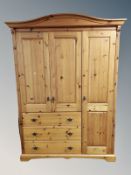 A contemporary pine compactum wardrobe,