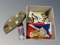 A quantity of military decorations, military cap bearing Soviet badges,