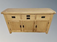 A contemporary oak sideboard,