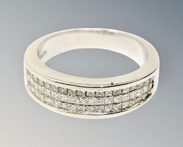 An 18ct white gold ring set with 54 princess cut diamonds CONDITION REPORT: Lot 147