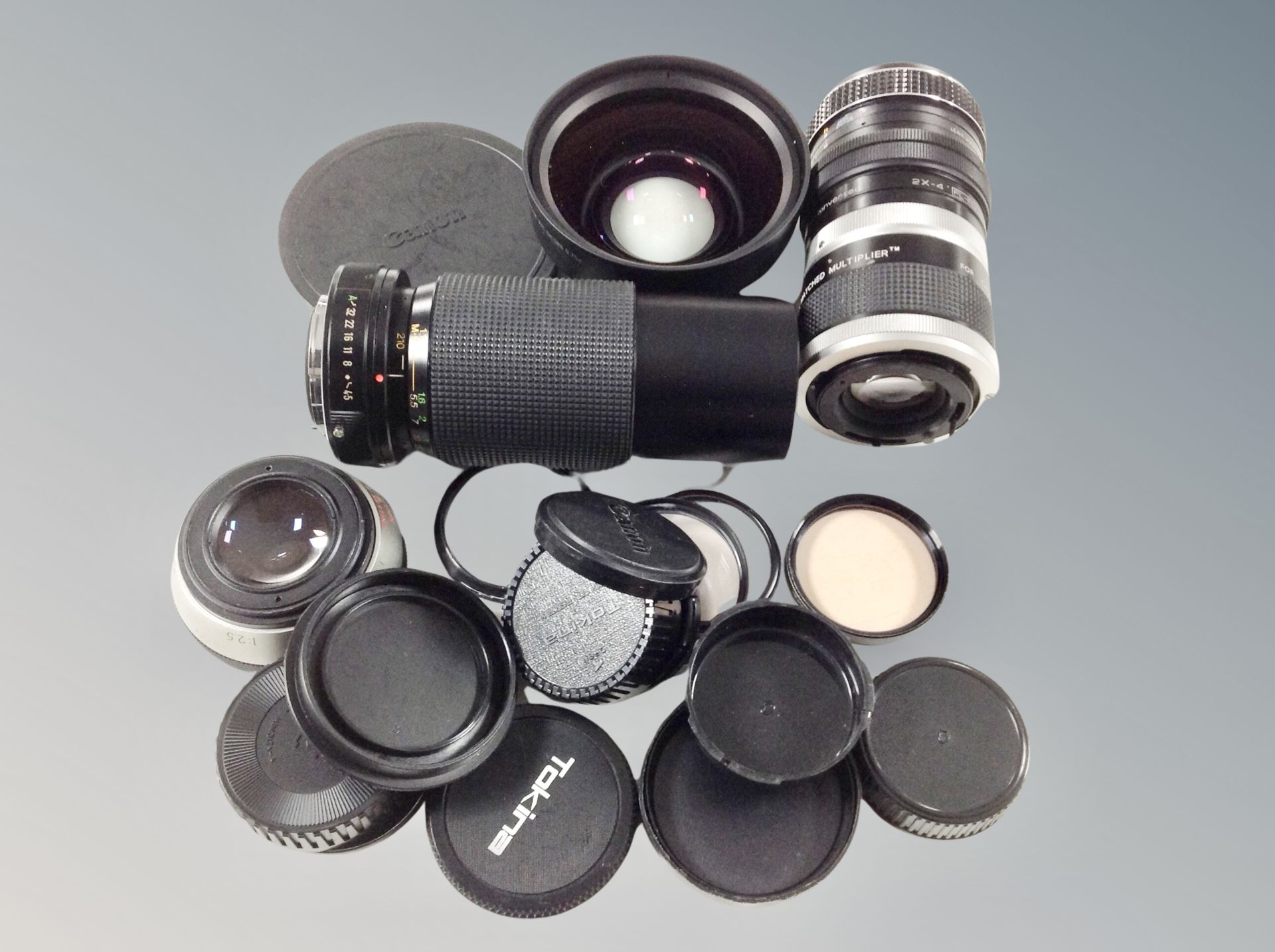 A Vivitar 70-210mm lens together with a further Vivitar automatic tele converter lens,