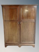 A Compactom Ltd mahogany double door wardrobe,