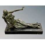 A contemporary patinated bronze sculpture on black marble plinth,