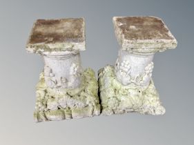 A pair of concrete garden pedestals,