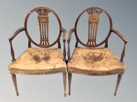 A pair of 19th century armchairs with studded brown leather seats