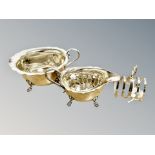 A collection of plated items, sauce boat,