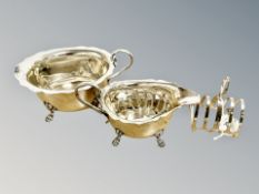 A collection of plated items, sauce boat,