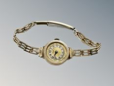 A lady's watch with 9ct gold case