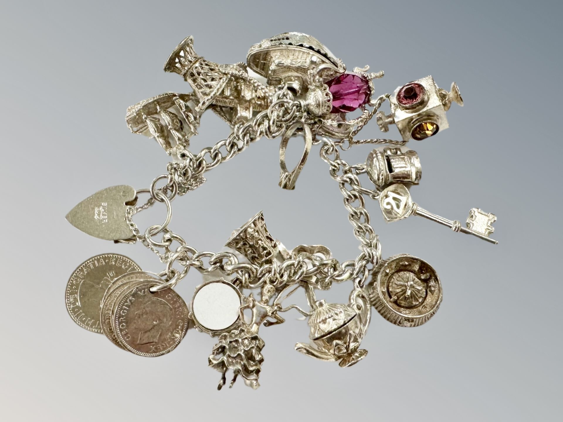 A silver charm bracelet, 82.2g.