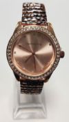A brand new lady's Red Herring watch with rose gold colour face and leopard print strap,