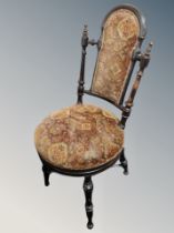 A 19th century ebonised occasional chair
