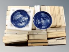 A quantity of boxed Bing & Grondahl blue and white collectors plates