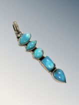 A silver turquoise pendant