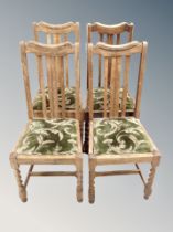 A set of seven oak barley twist dining chairs