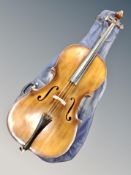 A cello with two piece 30 inch back labelled 'made in Hungary'