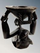 An African Mambila carved wooden libation vessel in the form of a mother carrying a child