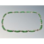 A silver mounted green stone necklace