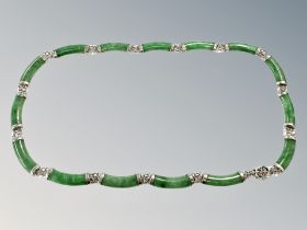 A silver mounted green stone necklace