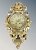 A Swedish gilt and gesso wall clock with key,