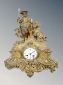 A 19th century gilt metal figural mantel clock, with enamelled dial,