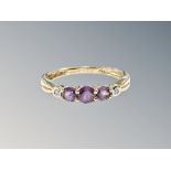 A 9ct yellow gold amethyst and diamond ring size L/M