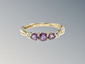 A 9ct yellow gold amethyst and diamond ring size L/M