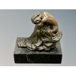 After Milo : A maiden seated on a rock, on marble base,