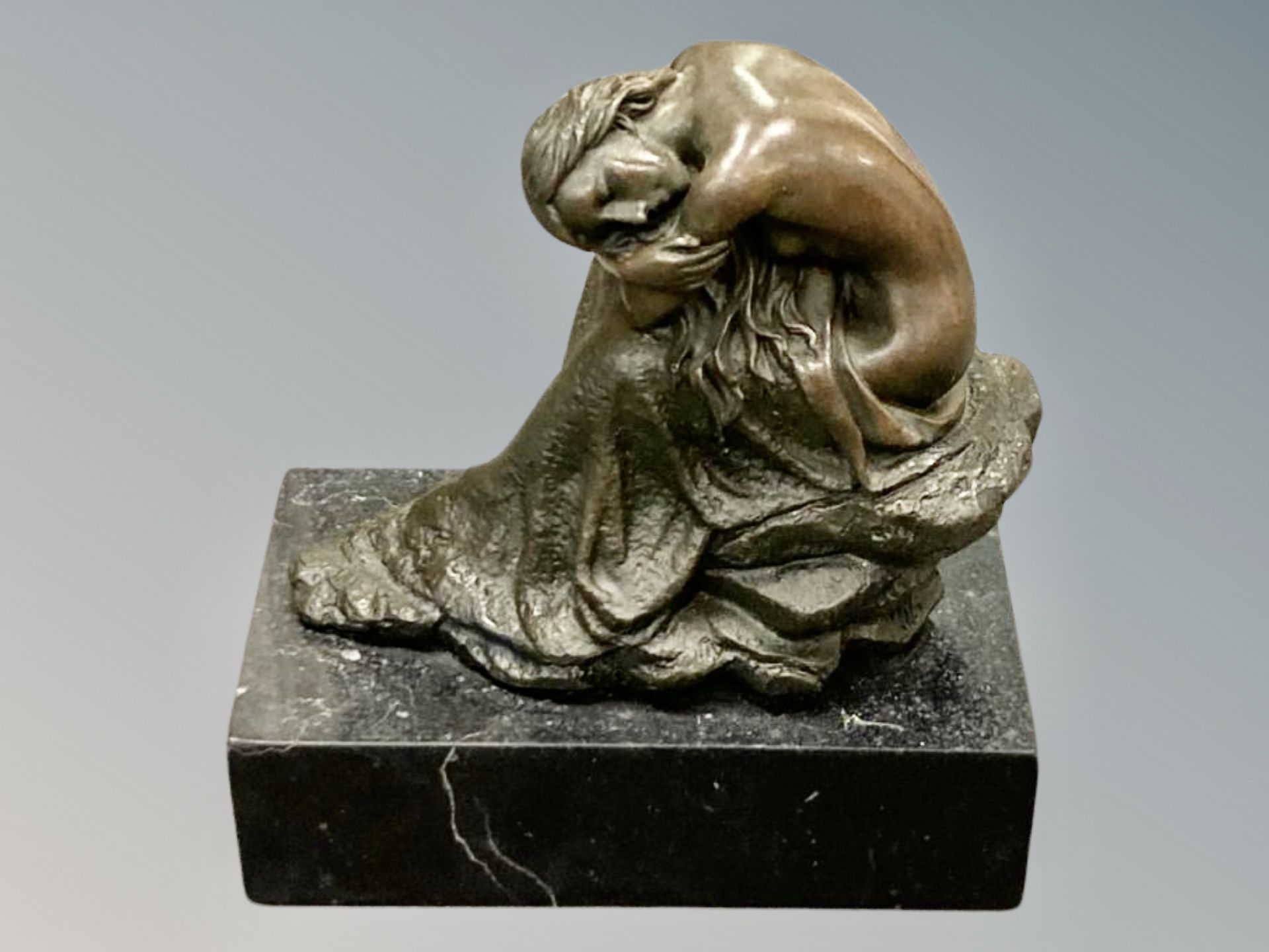 After Milo : A maiden seated on a rock, on marble base,