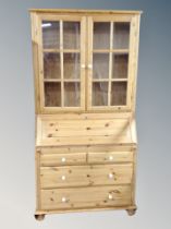 A contemporary pine double door bureau bookcase,