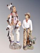 Two resin figures of a cowboy and Native American,
