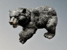 A bronze figure modelled as a large bear,