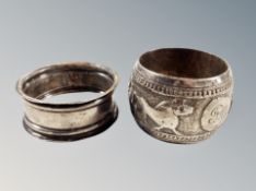 A silver napkin ring and further Indian white metal example