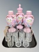 Three Victorian pink glass hand-painted urns, one with stopper,