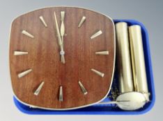 A Junghans teak and brass wall clock with pendulum and weights