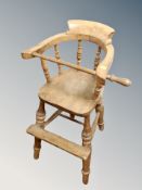 A 19th century elm child's Windsor high chair