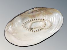 A Mother of Pearl dish and necklet