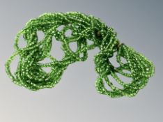 A green glass bead necklet