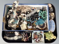 A tray of costume jewellery, atomiser, watches,