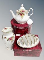 A Royal Albert Old Country Roses teapot and toast rack (both boxed) and a further vase
