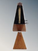 A walnut cased metronome