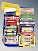 A group of boxed and unboxed die cast busses,