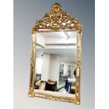 A Venetian style sectional gilt over mantel mirror,