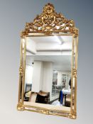 A Venetian style sectional gilt over mantel mirror,