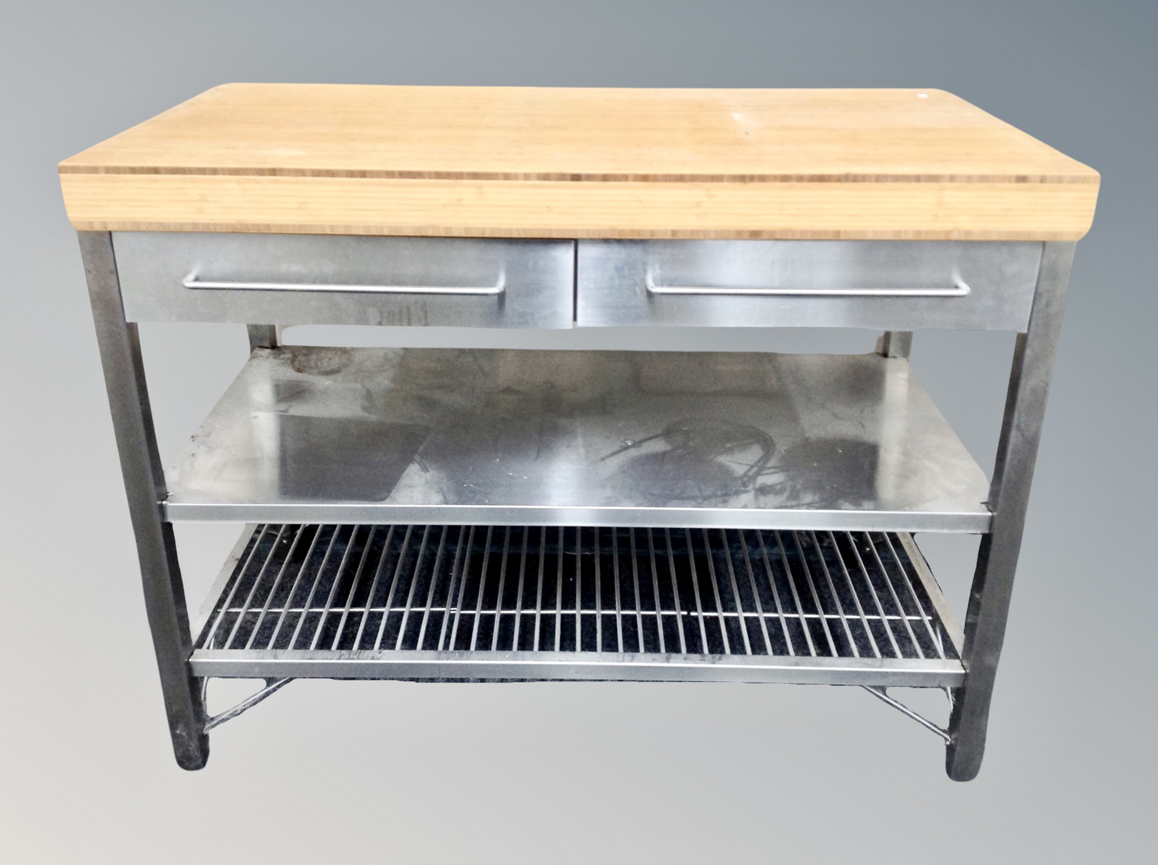 A stainless steel pine topped three tier preparation table fitted with drawers,