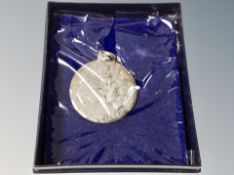 A silver Charles and Diana pendant