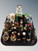 A collection of alcohol miniatures including Bells irish mist, Cointreau,