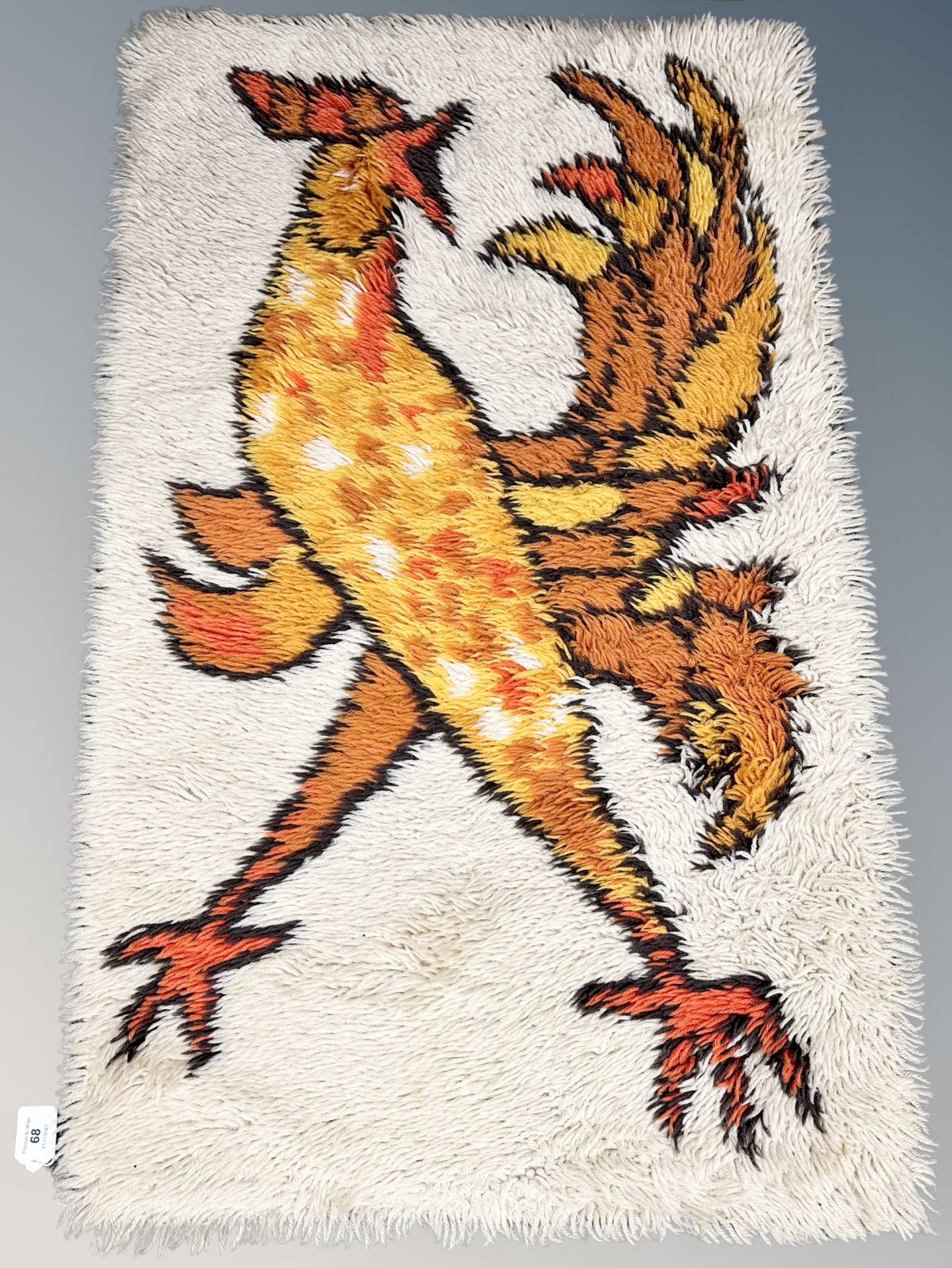 An Eastern woolen rug depicting a cockerel 110 cm x 69 cm